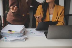 Team of business people working together in the meeting room office, teamwork background charts and graphs banner, double exposure successful teamwork,business planning concept. photo