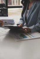 Team of business people working together in the meeting room office, teamwork background charts and graphs banner, double exposure successful teamwork,business planning concept. photo