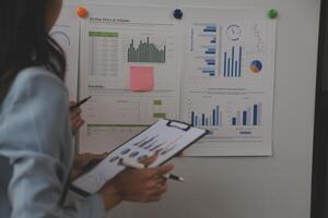 Team of business people working together in the meeting room office, teamwork background charts and graphs banner, double exposure successful teamwork,business planning concept. photo