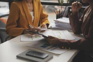 Team of business people working together in the meeting room office, teamwork background charts and graphs banner, double exposure successful teamwork,business planning concept. photo