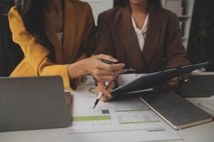 Team of business people working together in the meeting room office, teamwork background charts and graphs banner, double exposure successful teamwork,business planning concept. photo