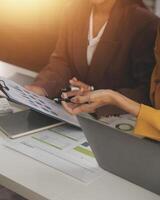 Team of business people working together in the meeting room office, teamwork background charts and graphs banner, double exposure successful teamwork,business planning concept. photo