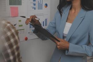 Team of business people working together in the meeting room office, teamwork background charts and graphs banner, double exposure successful teamwork,business planning concept. photo