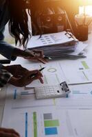 Team of business people working together in the meeting room office, teamwork background charts and graphs banner, double exposure successful teamwork,business planning concept. photo