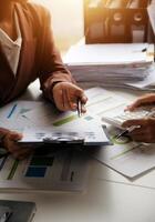 Team of business people working together in the meeting room office, teamwork background charts and graphs banner, double exposure successful teamwork,business planning concept. photo