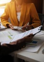 Team of business people working together in the meeting room office, teamwork background charts and graphs banner, double exposure successful teamwork,business planning concept. photo