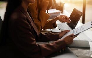 Team of business people working together in the meeting room office, teamwork background charts and graphs banner, double exposure successful teamwork,business planning concept. photo