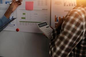 Team of business people working together in the meeting room office, teamwork background charts and graphs banner, double exposure successful teamwork,business planning concept. photo