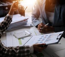 Team of business people working together in the meeting room office, teamwork background charts and graphs banner, double exposure successful teamwork,business planning concept. photo