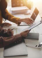 Team of business people working together in the meeting room office, teamwork background charts and graphs banner, double exposure successful teamwork,business planning concept. photo