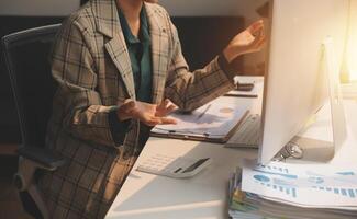 Team of business people working together in the meeting room office, teamwork background charts and graphs banner, double exposure successful teamwork,business planning concept. photo