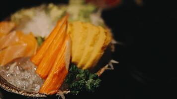 Japanese food set. Raw fish packed in a red, round object. The set consists of salmon, tuna, crab sticks, sweet egg. video