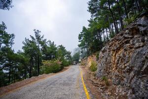 Road trip, view from car along to mountain roads and serpentines in mountain near Fethiye, Turkey. High quality photo