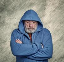portrait of sad, gloomy and contemplative senior man photo