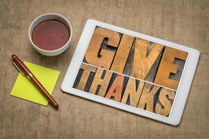 Give thanks word abstract on digital tablet photo
