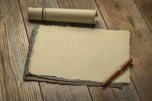 sheets of blank handmade paper with rough edges photo
