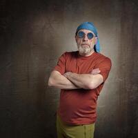 senior, handsome man with gray beard in skull cap photo