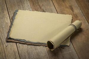 sheets of blank handmade paper with rough edges photo