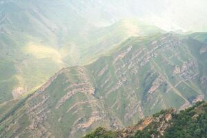 Caucasian mountain Dagestan. Trees, rocks, mountains, view of the green mountains. Beautiful summer landscape. photo
