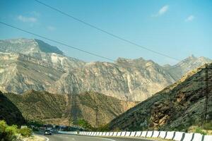 View from the car of an asphalt road in the mountainous area of Dagestan photo