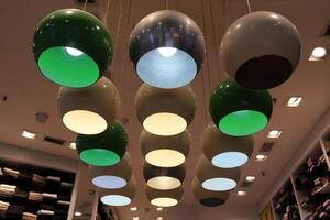 A lamp for illuminating the interior of the room hangs on the ceiling. photo