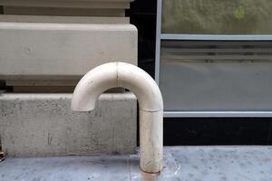 Water tap and pipes for pumping water to the pumping station. photo