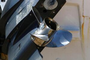 The propeller of a motor boat at the pier in the seaport. photo