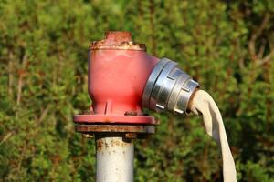Water tap and pipes for pumping water to the pumping station. photo