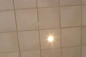 A lamp for illuminating the interior of the room hangs on the ceiling. photo
