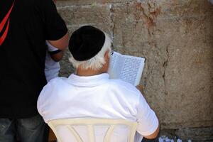 07 13 2023 Jerusalem Israel. The Western Wall is part of the ancient wall around the western slope of the Temple Mount in the Old City of Jerusalem. photo