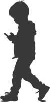 silhouette little boy walking while playing on smartphone black color only vector