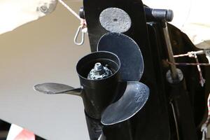 The propeller of a motor boat at the pier in the seaport. photo