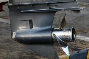 The propeller of a motor boat at the pier in the seaport. photo