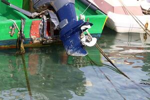 The propeller of a motor boat at the pier in the seaport. photo