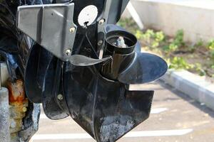 The propeller of a motor boat at the pier in the seaport. photo