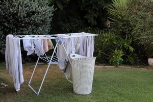 Washed laundry hangs on a rope outside the window. photo