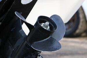 The propeller of a motor boat at the pier in the seaport. photo