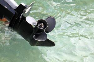 The propeller of a motor boat at the pier in the seaport. photo
