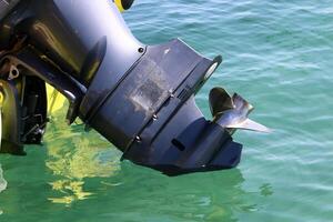 The propeller of a motor boat at the pier in the seaport. photo