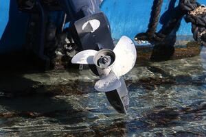 The propeller of a motor boat at the pier in the seaport. photo
