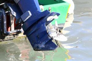The propeller of a motor boat at the pier in the seaport. photo