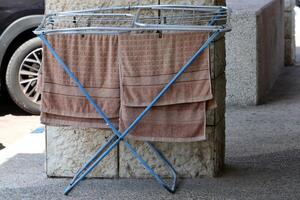 Washed laundry hangs on a rope outside the window. photo