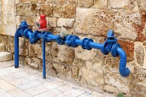 Metal water pipes and taps photo