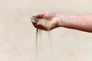 A person's hand holds objects close-up. photo