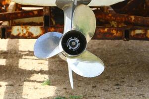 The propeller of a motor boat at the pier in the seaport. photo