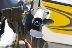 The propeller of a motor boat at the pier in the seaport. photo