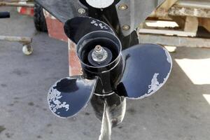 The propeller of a motor boat at the pier in the seaport. photo