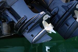 The propeller of a motor boat at the pier in the seaport. photo