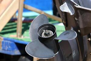 The propeller of a motor boat at the pier in the seaport. photo
