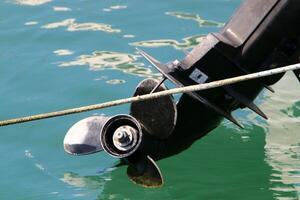 The propeller of a motor boat at the pier in the seaport. photo